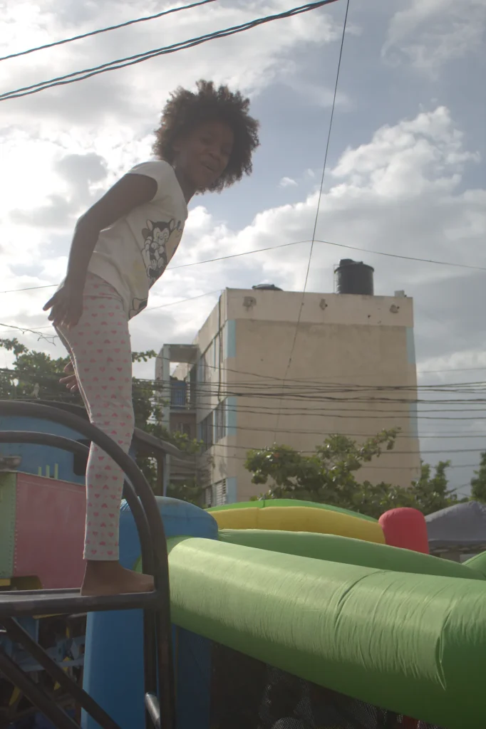 Child playing on an inflatable during the Give Back in Trench Town, Jamaica.