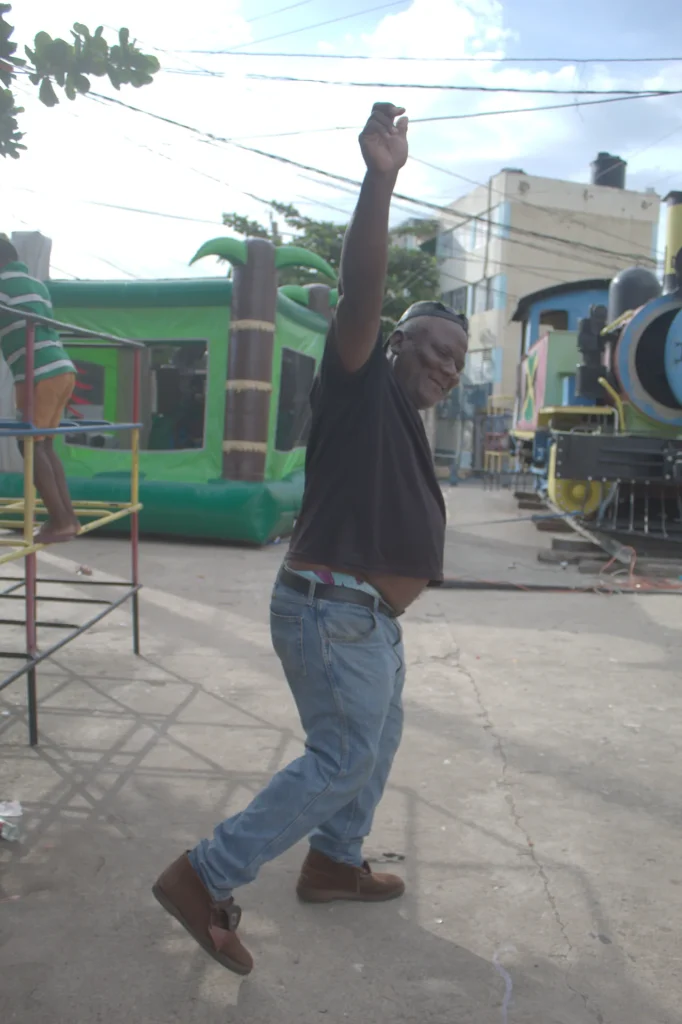 Man dancing during the Chuchu Benz Foundation Give Back in Trench Town, Jamaica.